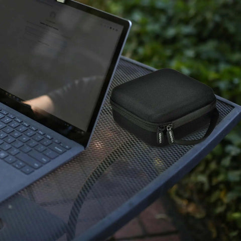 Slick Clutch Hard Shell Case For Travel Routers With Snug Mesh Pocket And Heavy Duty Zipper For Gl Mt3000 Gl Be3600 on table