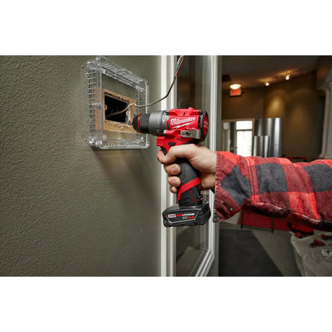 M12 Fuel Half Inch Hammer Drill Driver With Brushless Motor in use drilling a wall, lightweight subcompact tool in action