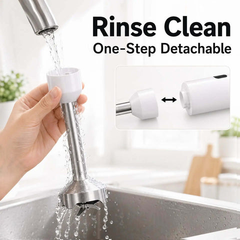 Rinsing detachable end of the Cordless Immersion Hand Blender And Stick Blender under running water in a kitchen sink.