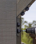 ZMAX Black Powder Coated Knee Brace Connector For 4X Lumber Outdoor Accents Avant Collection 12-Gauge Steel in use with drill