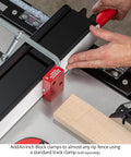 Rugged One Inch Offset Table Saw Fence Stop Featuring Slick Clamp On Design for Rapid Rip Fence Setup and Crosscuts in use on workshop table.