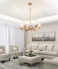 Six Light Gold Chandelier With White Frosted Glass Shades For Dining Room Living Room Kitchen And Bedroom Modern Chic Fixture For Warm Vibe And Easy Install above a stylish living room.