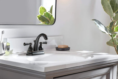 Elmhurst Two-Handle Centerset Bath Faucet in Oil Rubbed Bronze on white sink