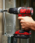Beefy Compact Cordless Hammer Drill And Driver Kit With Half Inch Chuck And Frameless Motor in use, showing power and precision.