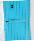 Front view of heavy-duty T-shaped hinge for wood gates, black metal, installed on a blue door