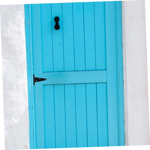 Front view of heavy-duty T-shaped hinge for wood gates, black metal, installed on a blue door