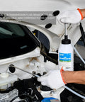 Front view of SMOTIVEPRO 1 Litre multi-purpose hand pump with clear tubing in a car engine bay