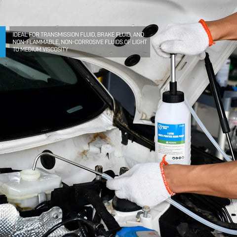Front view of SMOTIVEPRO 1 Litre multi-purpose hand pump with clear tubing in a car engine bay
