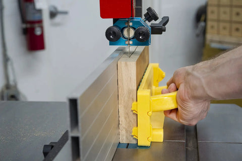 Grr-Rip Block 3D Pushblock System For Table Saws, Smart Pushblock in use on bandsaw guiding wood for precise cut, yellow handle visible