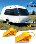 Heavy Duty Wheel Chocks For Rvs And Trailers, Non Slip Tire Stoppers With Durable Rope, Grooved Parking Blocks for a white camper on grass.
