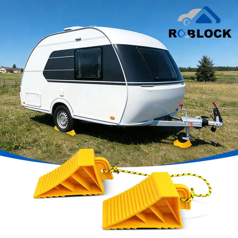 Heavy Duty Wheel Chocks For Rvs And Trailers, Non Slip Tire Stoppers With Durable Rope, Grooved Parking Blocks for a white camper on grass.
