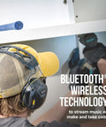 Person wearing WorkTunes Connect Wireless Hearing Protector With Bluetooth Technology 26 dB Noise Reduction Rating