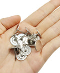 50 Piece Flat Head Thumb Tacks With Slick Silver Finish Heavy Duty Solid Steel Push Pins in a hand for easy handling.