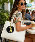 Woman with white bag using Four Piece Heart And Star Carabiner Keychain Clips In Gold And Silver Durable Alloy For Crafts Bags