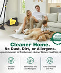 Family relaxing in home with Mighty Mite Vacuum Cleaner on beige carpet next to sofa with dog and child, promoting dust-free environment.