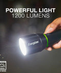 Person holding black Vision HD Rechargeable LED Flashlight With Digital Focus, Water Resistant Emergency Light in a dark room.