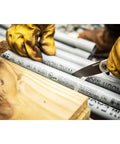 Worker using 3 1/4 Inch Drop Point Pocket Knife With Aluminum Handle, D2 Steel Blade on conduit pipe outdoors