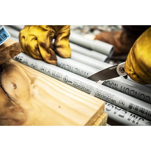 Worker using 3 1/4 Inch Drop Point Pocket Knife With Aluminum Handle, D2 Steel Blade on conduit pipe outdoors