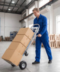 Convertible Hand Truck With Dual Wheel Modes Two In One Heavy Duty Cargo Trolley For Moving Boxes And Equipment Wide Platform Lightweight Yet Rugged Rust Resistant Perfect For Home Shop And Job Site, worker moving stacked boxes in warehouse