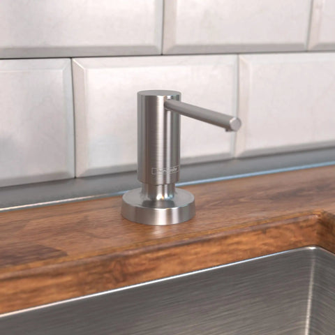 Talis Modern Bath And Kitchen Sink Soap Dispenser In Stainless Steel Optic on wooden counter near tile backsplash