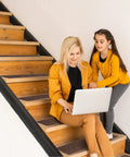 Woman and child sitting on wooden steps with No Slip Stair Treads 8 By 30 Inches 15 Pack With Pre Applied Adhesive Indoor Stair Carpet Runners