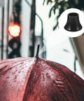 Top Shelf Black Plastic Umbrella Tip Protector Caps For Long Handle Canes And Patio Parasols on red umbrella, showing snug fit and heavy duty design.