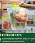 Person holding 24 Pack Reusable Food Storage Bags Dishwasher Safe Microwave Safe BPA Free Freezer Bags filled with produce
