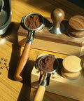 Sturdy Wood Espresso Tamper Holder And Coffee Grind Catch Tray With Non Slip Grip, displaying wooden tamper holder with coffee grounds.