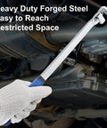 Gloved hand using Heavy Duty Steel Wrench Extender Bar 15 Inches Long for extra leverage in a car engine for tightening bolts.