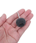 Hand holding abrasive wheel from 100 Piece 1 Inch Abrasive Wheel Kit With Double Layer Surface Conditioning Wheels And Composite Buffing Structure 120 600 Grit Ideal For Metal Deburring And Hardware Polishing Fits Most Rotary Tools Great For Diy Projects.