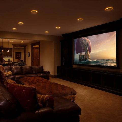 No Sweat 4 Pack Of 6 Inch Ic Rated Led Recessed Can Lights with Amber glow illuminating a cozy movie room.