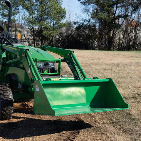 5 Foot Dirt Bucket Attachment For Tractors That Fits John Deere Hook And Pin Tractors in a field, attached to green tractor