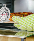 Big 3.5 Inch Oven Thermometer For Gas And Electric Ovens with a pizza baking inside the oven, checked for temperature accuracy.
