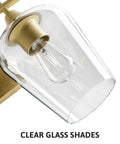 Close-up of Two Light Brushed Gold Vanity Light With Clear Glass Shades For Bathroom Over Mirror Modern Wall Sconce