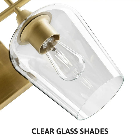 Close-up of Two Light Brushed Gold Vanity Light With Clear Glass Shades For Bathroom Over Mirror Modern Wall Sconce