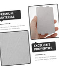 Hand holding a mica insulation sheet, part of a 10 Piece Mica Insulation Sheets For Microwave Ovens, Heat Resistant Waveguide Covers set.