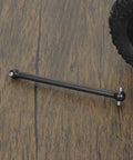 Rear Driveshaft Dogbone 82mm Number 45 Steel For Arrma Outcast Notorious Typhon 6S BLX Upgrade Parts Compatible With ARAC4030 AR310470 Black Heavy Duty Performance For Durable RC Racing Confidence. 82mm black steel dogbone beside RC wheel