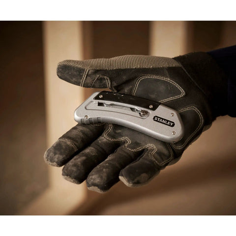 Gloved hand holding Sport Knife With Easy Blade Change And One Handed Quick Slide Blade Slider Takes Standard Utility Blades Silver Finish