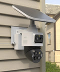 Slick No Drill Vinyl Siding Mount Clip For Eufycam S4 Security Camera mounted on vinyl siding, featuring a solar panel and dual lenses.