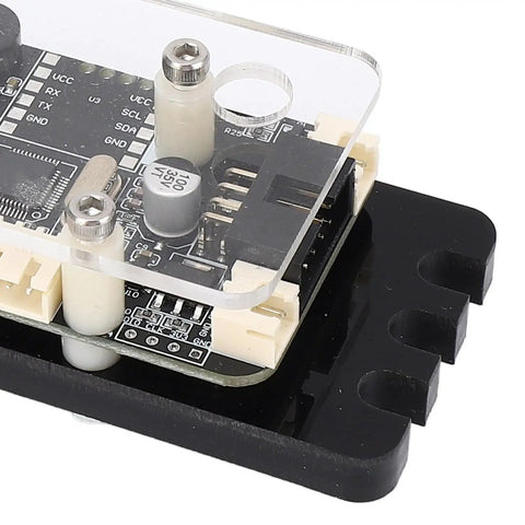 Close-up of GRBL 32 Bit CNC Engraving Control Board with Optimized Algorithms on a black mount, showcasing detailed components.