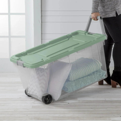 Heavy Duty Rolling Storage Bins, 40 Gallon Capacity, 2 Pack Garage Organization Cart With Wheels, Hella Tough Mobile Container For Moving Supplies, Workshop Tools, And Camping Gear, Green Sage with pillows and blankets.