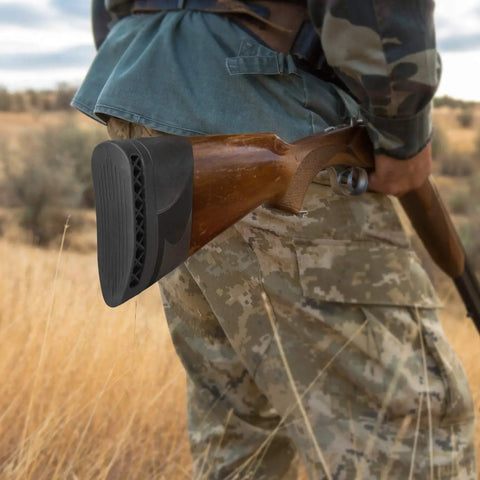 Hunter holding rifle with silicone recoil pad, "Beef Up Your Aim With This Gun Butt Stock Recoil Pad For Hunting And Shooting Black Silicone Cushion" visible