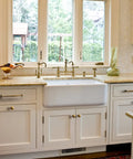 Vintage Retro Brass Cabinet Knobs Set Of 6 Zinc Alloy Pulls in a bright kitchen with white cabinets and farmhouse sink
