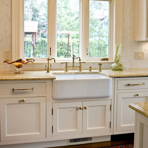 Vintage Retro Brass Cabinet Knobs Set Of 6 Zinc Alloy Pulls in a bright kitchen with white cabinets and farmhouse sink