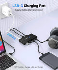 Two In Four Out USB 3.0 Switcher For Two Computers With Four Shared USB Ports, connected to laptop and devices for easy sharing