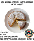 Baked cake with slice cut out on white plate using Shelf-Stable Shortening Powder For Frying And Baking, 12 oz can, Made In USA.