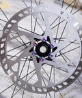 220mm Bike Disc Brake Rotor Thickened To 2.3mm With Rapid Heat Dissipation, vented, showing colored bolts and vent design.