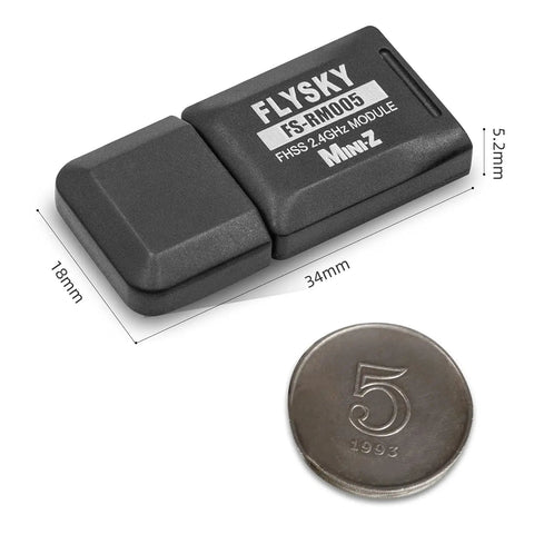 Flysky FS RM005 FHSS 2.4GHz Module For NB4 Plus And NB4 Pro Plus Transmitters next to coin for size comparison