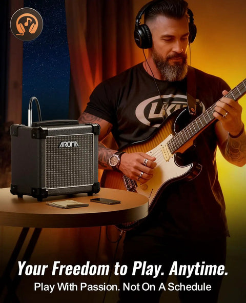Man playing guitar with 10W Bluetooth Guitar Amp With A Solid Wood Cabinet For A Full, Warm Home Jam nearby
