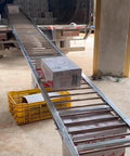Heavy Duty Galvanized Steel Roller Conveyor For Warehouse Freight And Logistics Unloading with boxes moving down ramp.